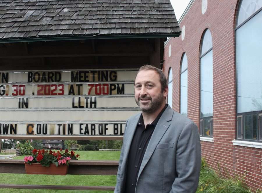 Clay Arsenault, Long Lake Town supervisor stands in front of the town hall.