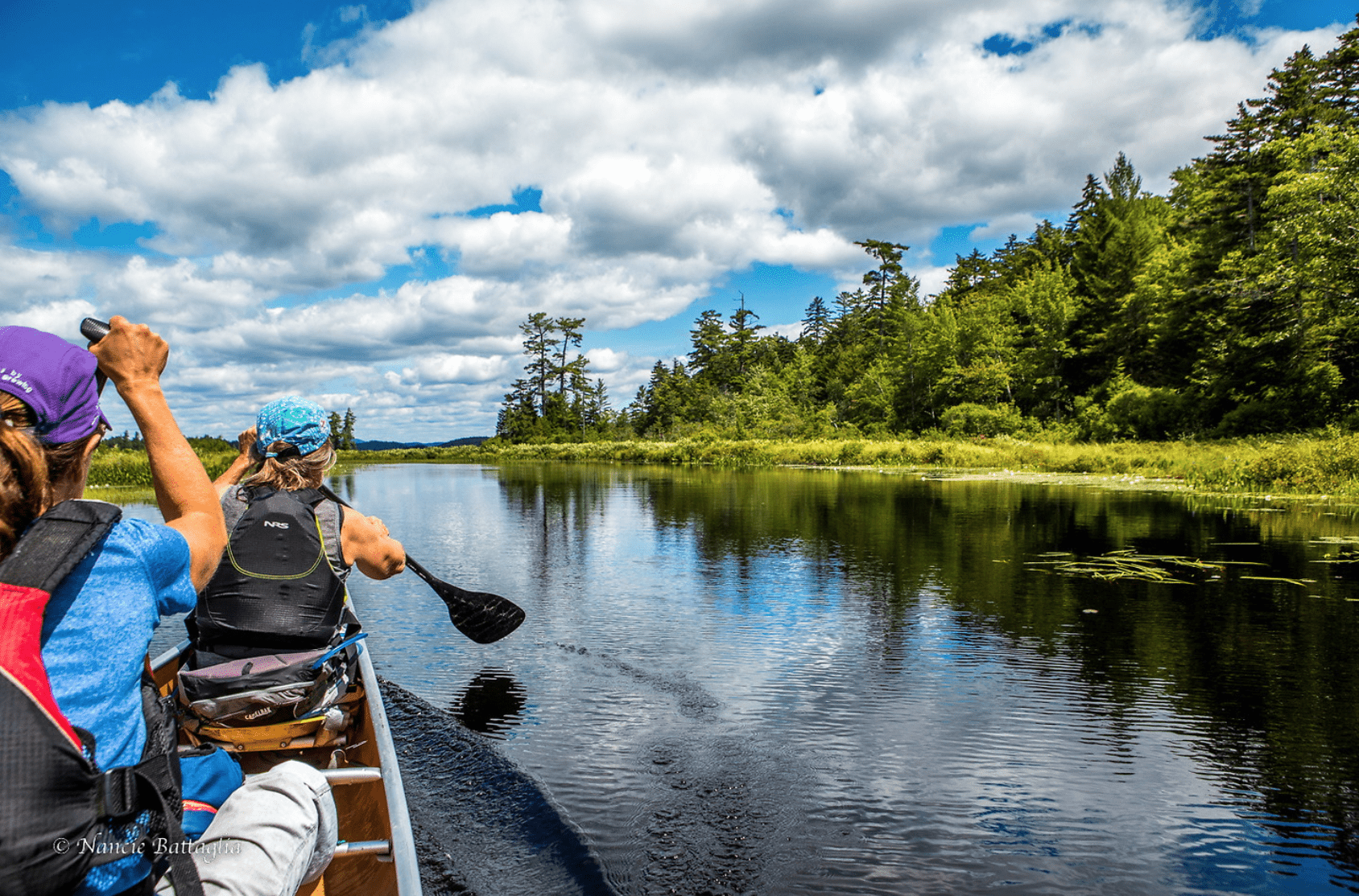 Canoeists paddle on Rock Pond outlet in the William C. Whitney Wilderness, which lacks a unit management plan