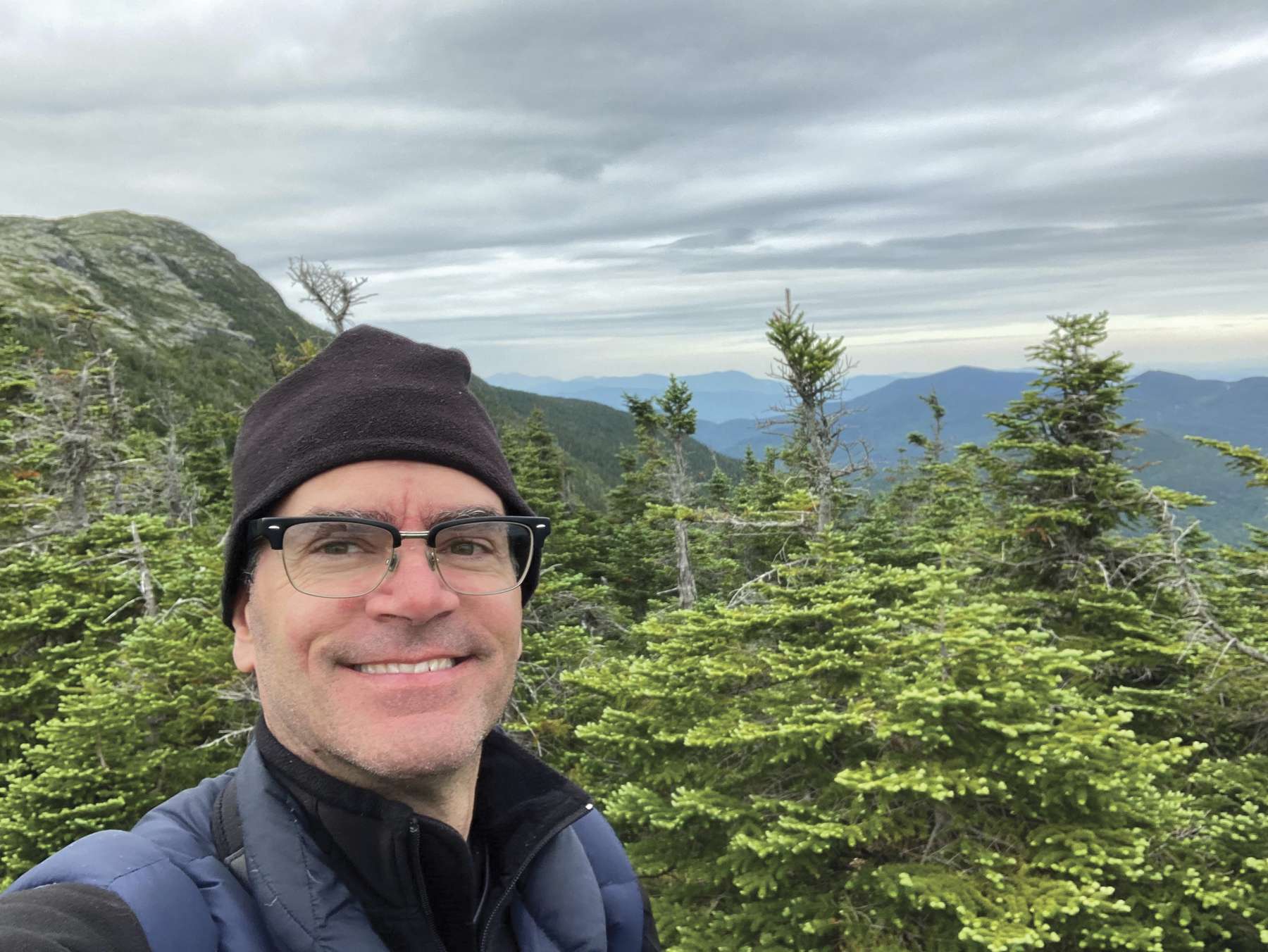 New York State Museum Ornithologist Jeremy Kirchman researches birds atop Vermont's Mount Mansfield. Photo courtesy of Jeremy Kirchman