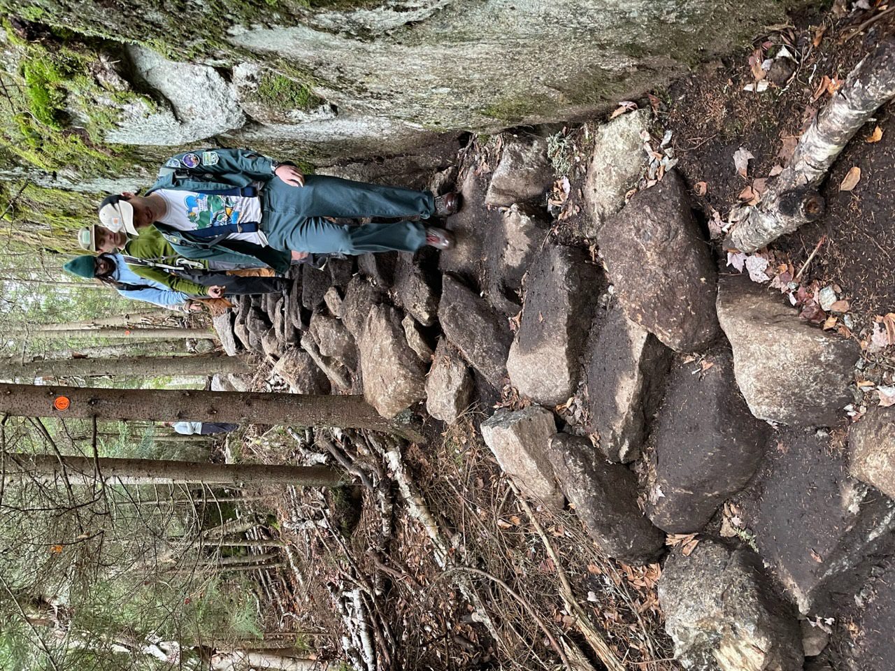 Trail crews inspect their work on a “legendary” rock staircase. Photo by Tim Rowland