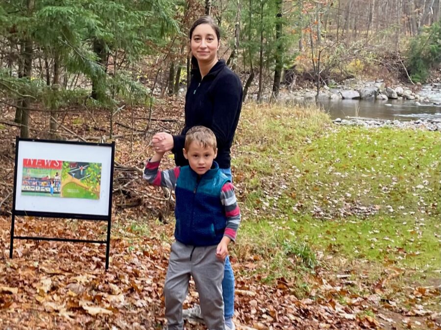 Mom and young son on Keene story trail
