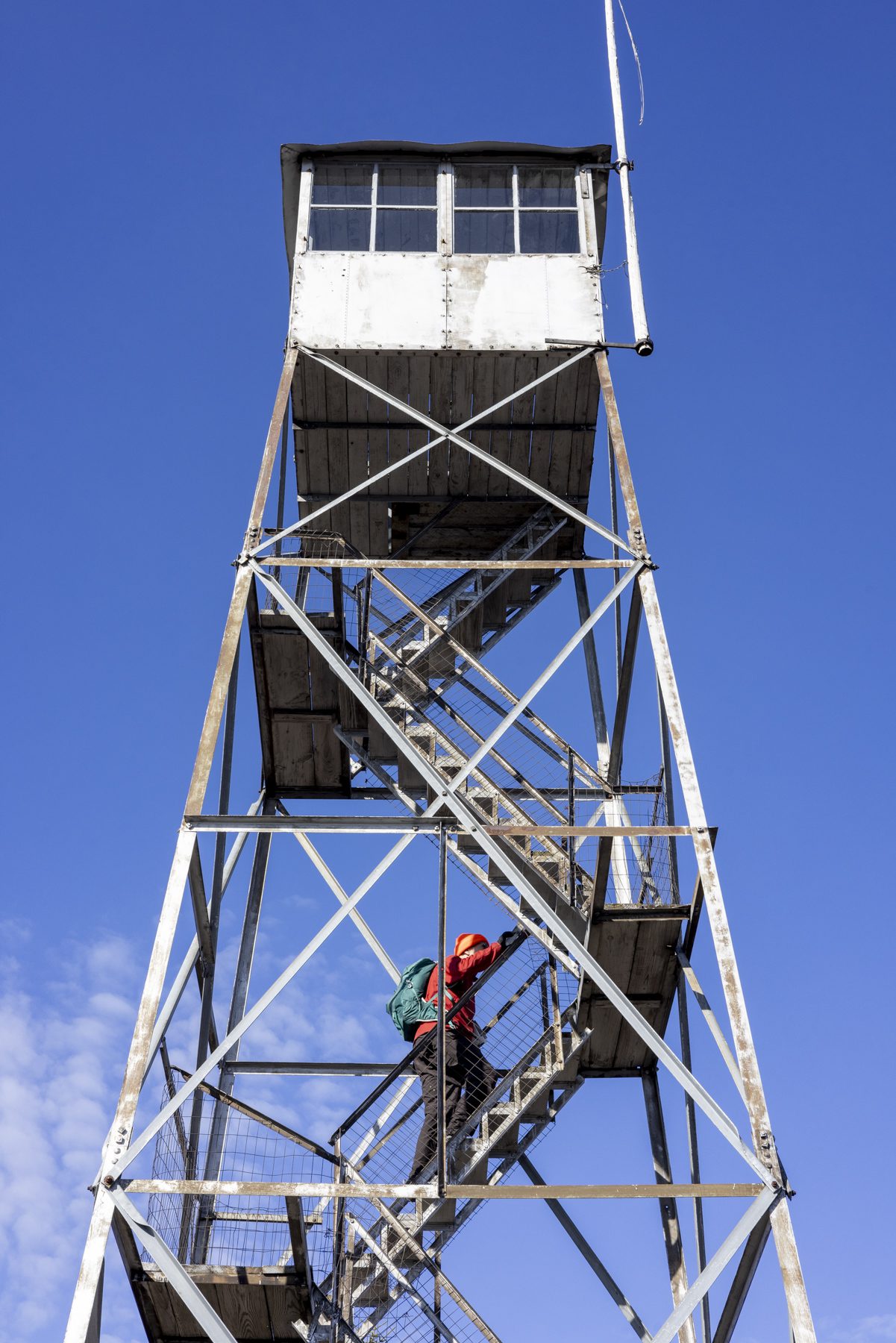 The Poke-O-Moonshine fire tower offers views in all directions, including to the north where one can see Plattsburgh and to Montreal on a clear day. The cab is only open during the warming hiking season.  Photo by Mike Lynch