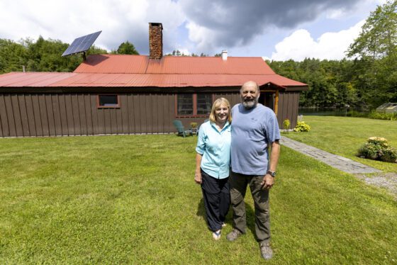 Rodney Morgan and Donna Kagiliery in front of their home in the southern Adirondacks