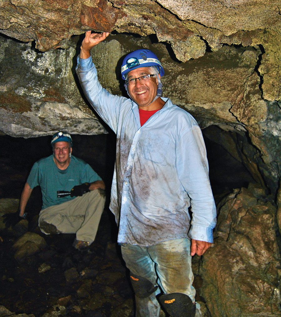 two men in a cave