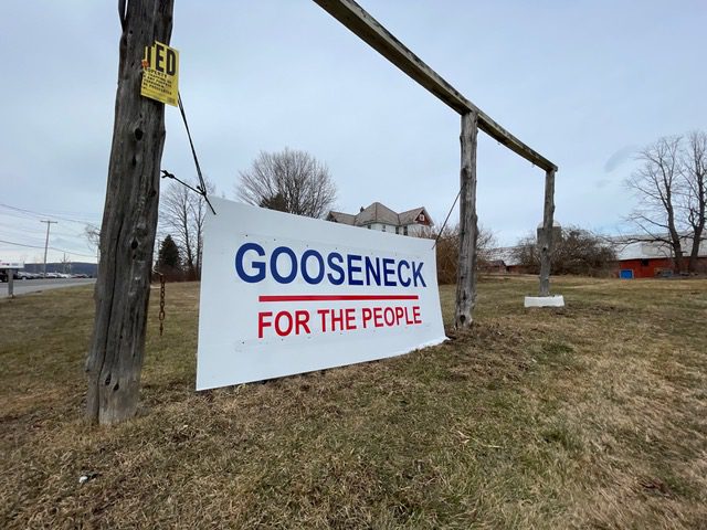 sign reading "gooseneck for the people"