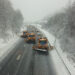 snowplows dropping rod salt on snowy road