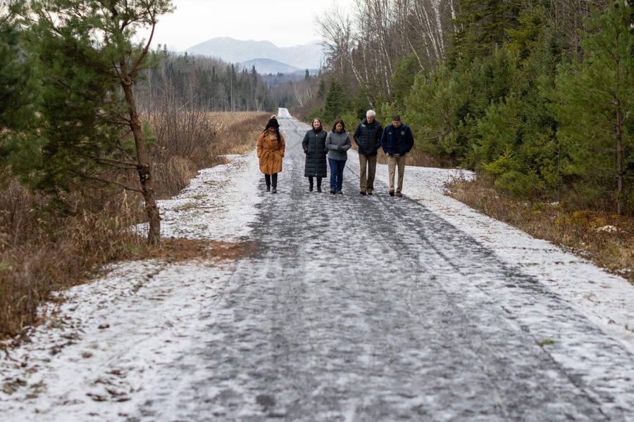 State officials walk down the Adirondack Rail Trail Friday. Photo by Mike Lynch