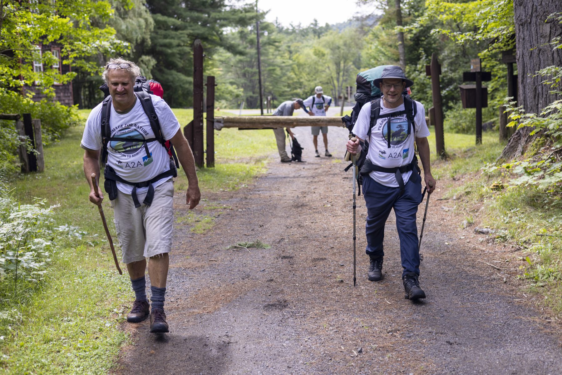 amieson Findlay, right, and Bill Barkley walk down the Camp Santanoni carriage road in Newcomb on August 12. Photo by Mike Lynch