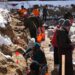 Volunteers work on dig site in Lake George