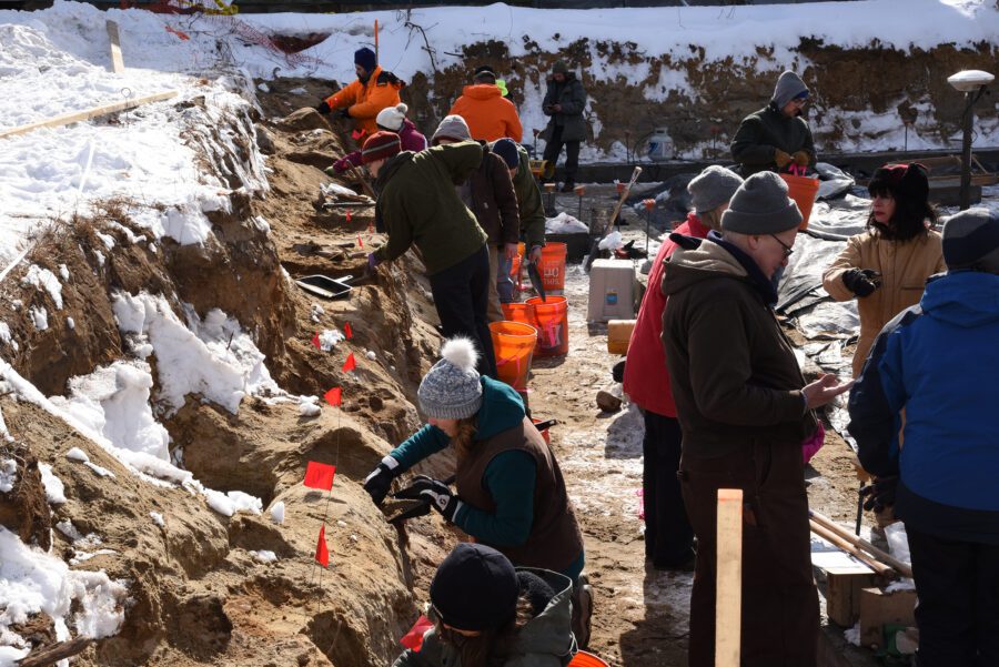 Volunteers work on dig site in Lake George