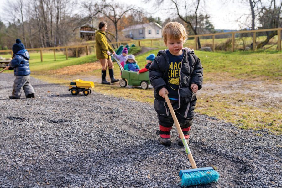 little boy playing outside at a childcare center