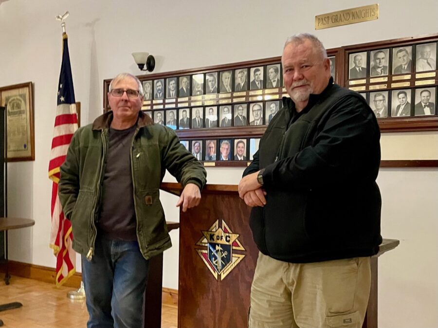 Two men with a knights of columbus podium