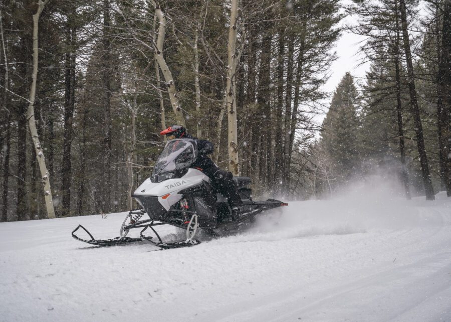 An electric snowmobile in motion