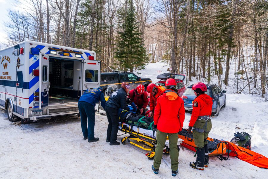 rangers transport injured person to an ambulance