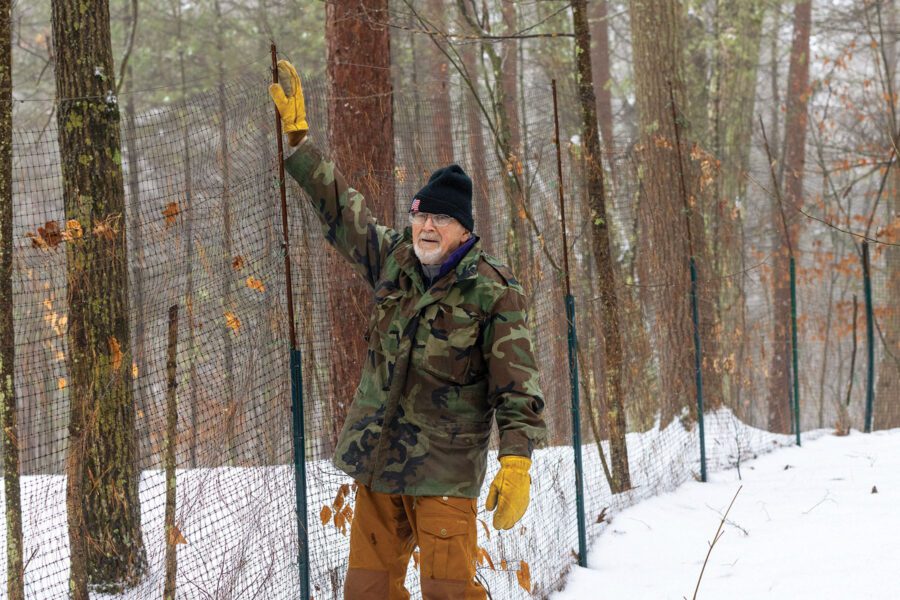 man with deer fence
