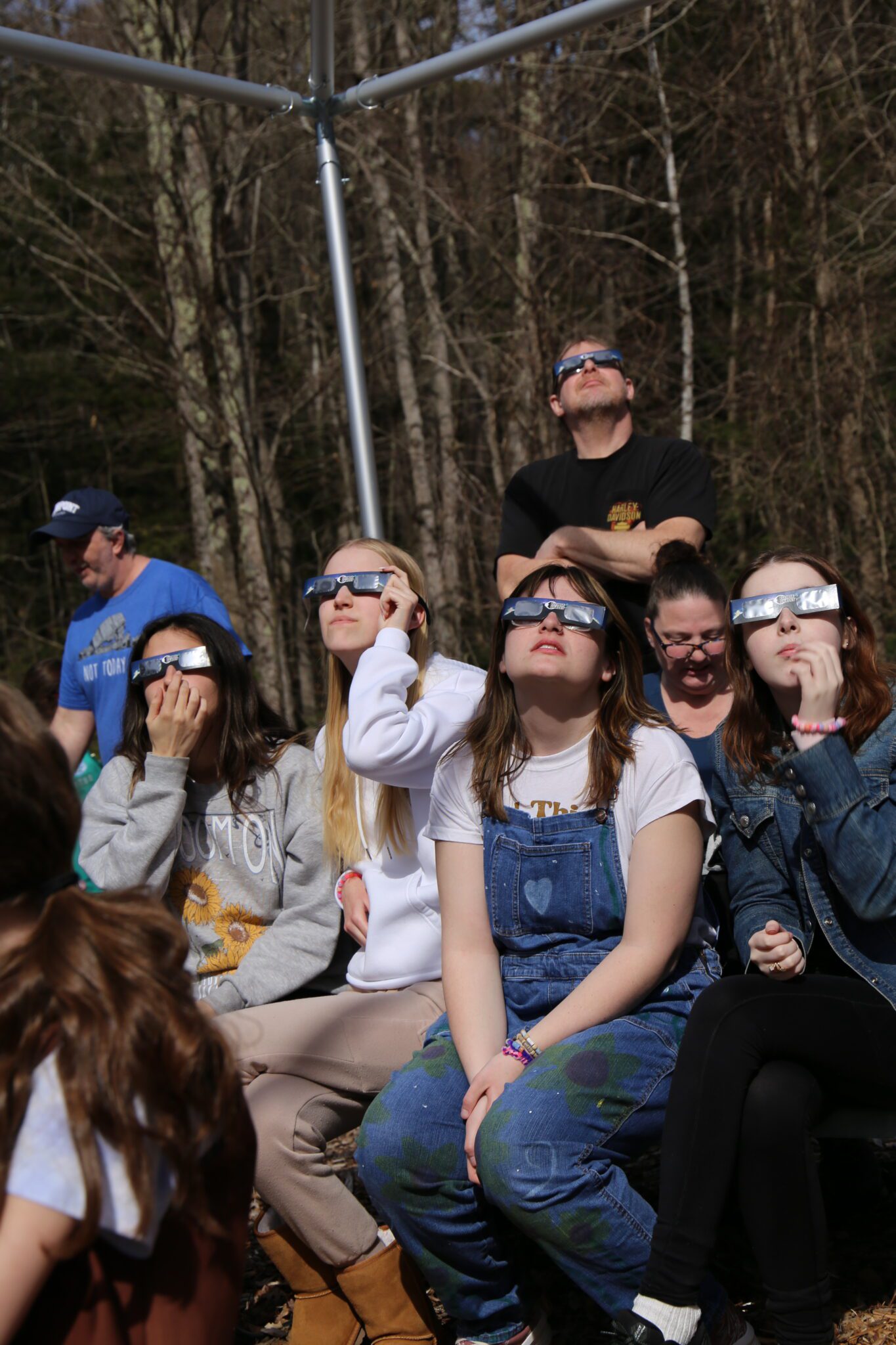 The Girl Scouts of Northeastern New York and their families watch the solar eclipse at Hidden Lake Camp in Lake Luzerne. Photo by Gwendolyn Craig