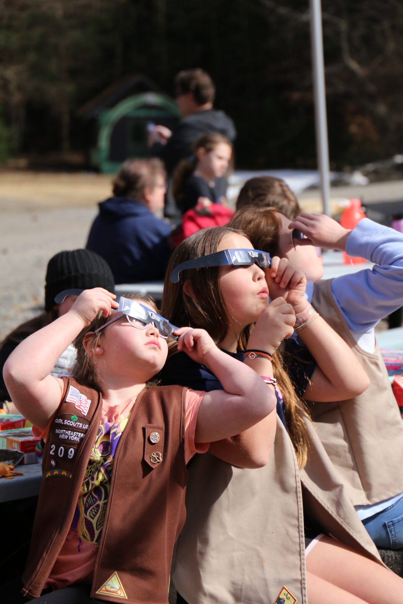 The Girl Scouts of Northeastern New York and their families watch the solar eclipse at Hidden Lake Camp in Lake Luzerne. Photo by Gwendolyn Craig