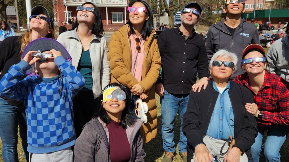 A group watching a solar eclipse