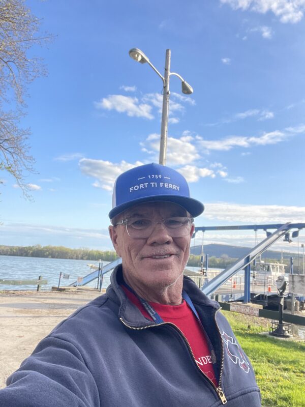 Man in blue cap, Jack Doyle, owner of the Fort Ticonderoga Ferry, is seeking an injunction to prevent cable installation from interfering with his operation. 