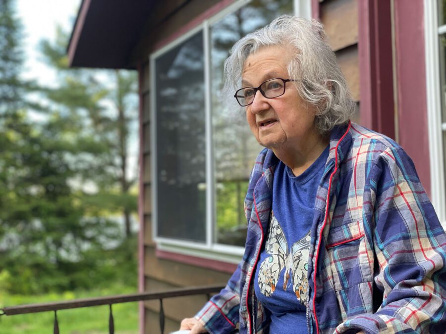 Adirondack gardener Dana Fast, an older woman with a butterfly on her shirt