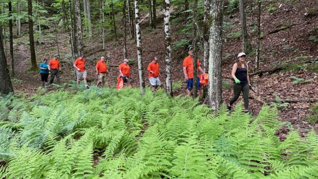 Mountain Lake’s crew looks for blowdown to clear on the Mt. Gilligan trail.