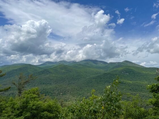 Rocky Peak Ridge disappears in the clouds from Mt. Gilligan.
