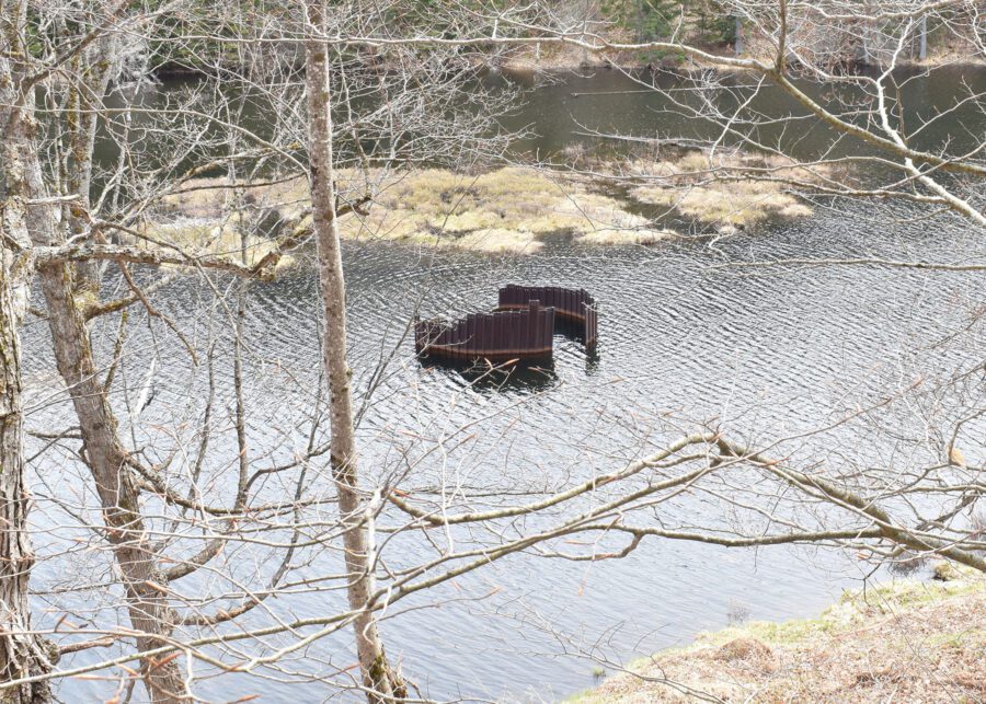 A round metal cistern in water.