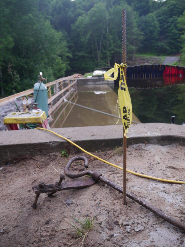 A flag marks the height of the Bartlett Carry Dam's raised embankment after construction is finished.