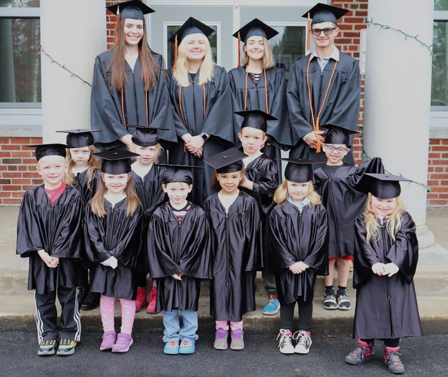 Indian Lake's Class of 2024 poses with the kindergarten class in caps and gowns. Photo courtesy of Photo courtesy of Holly O'Meara, senior class advisor.