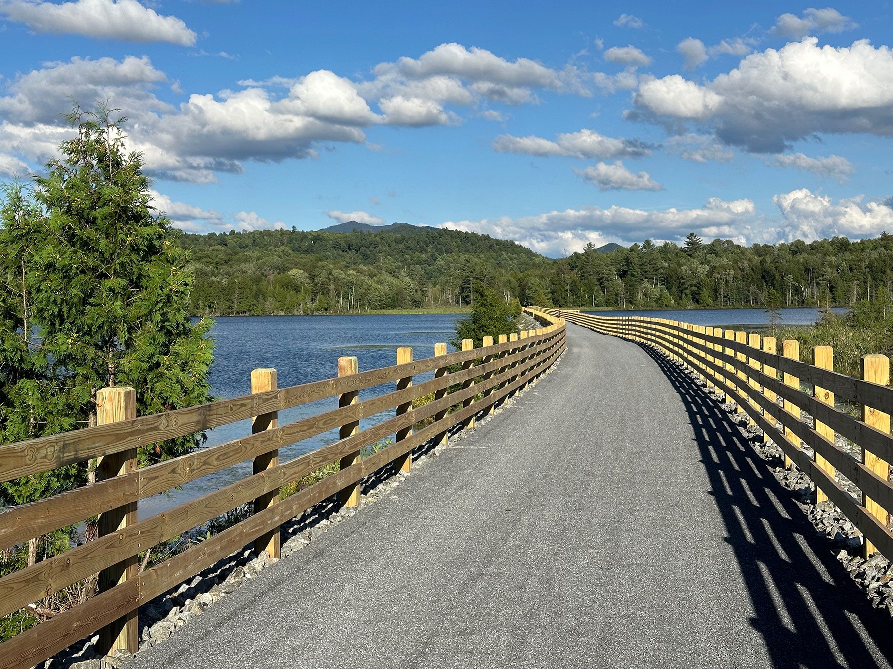 The new rail trail features fencing and viewing platforms on the Lake Colby causeway in Saranac Lake.