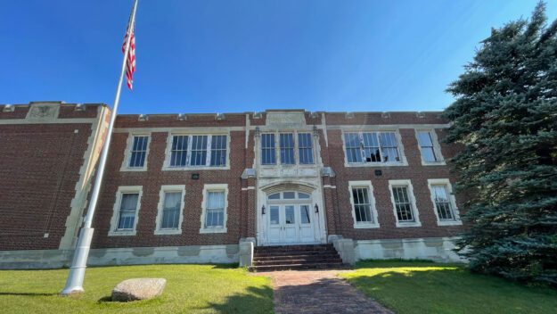 The exterior of a red brick school building