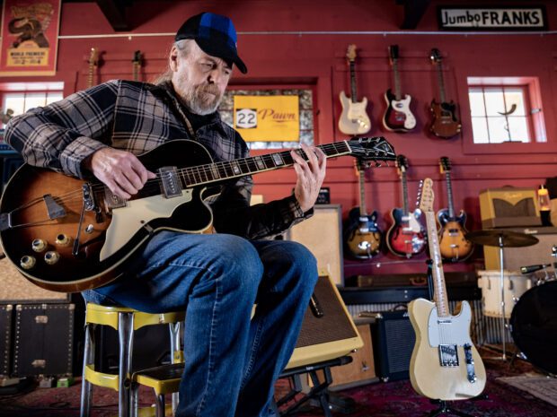 Ralph Lane, multi-instrumentalist and luthier from Crown Point, playing a 1959 Kay Barney Kessel, named after the American jazz guitarist, at 22 Pawn in Essex.