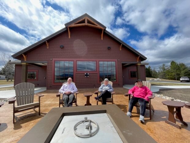 Dave Hughes and Newcomb council members Mary Lamphear and Lana Hennessy outside Newcomb’s new visitor and community center.