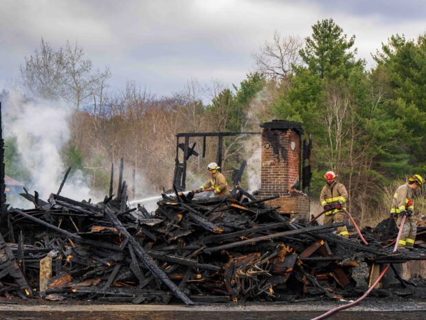 firefighters on a smoldering
