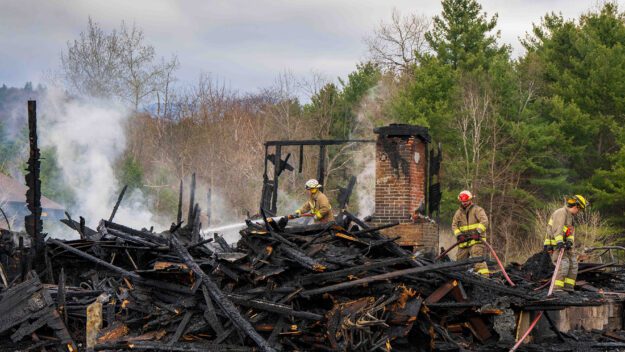 firefighters on a smoldering