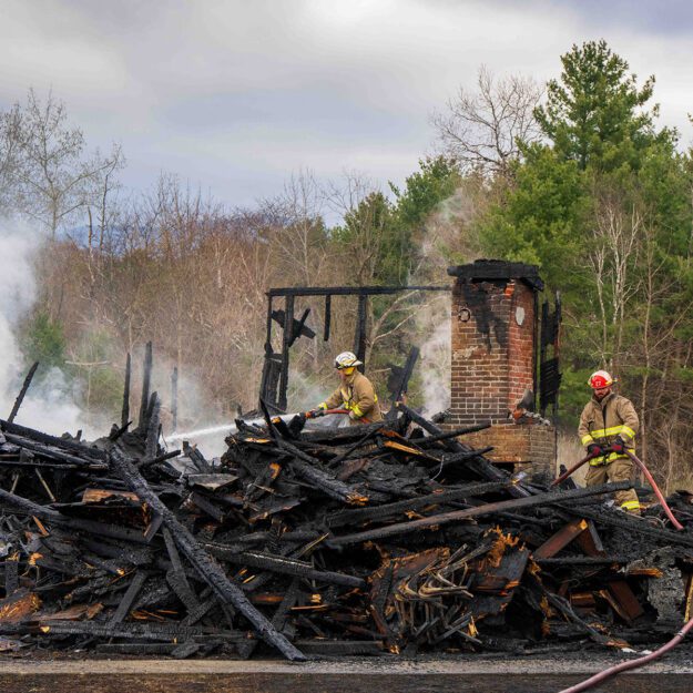 firefighters on a smoldering