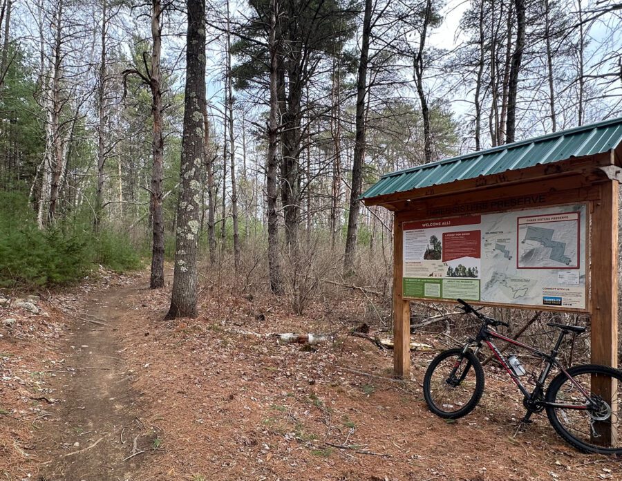 bike leaning on a sign