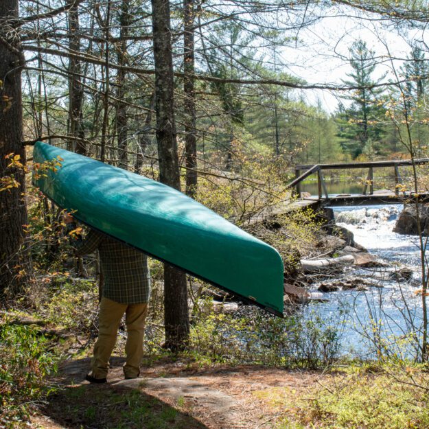 Man carries canoe
