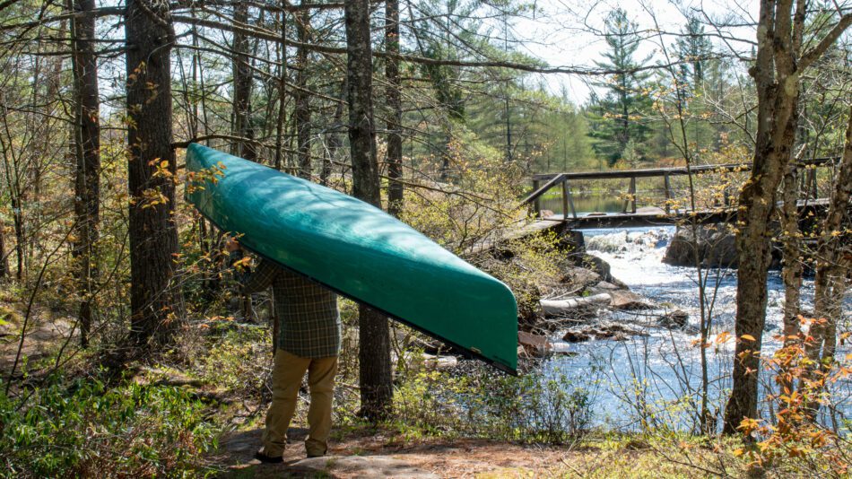 Man carries canoe