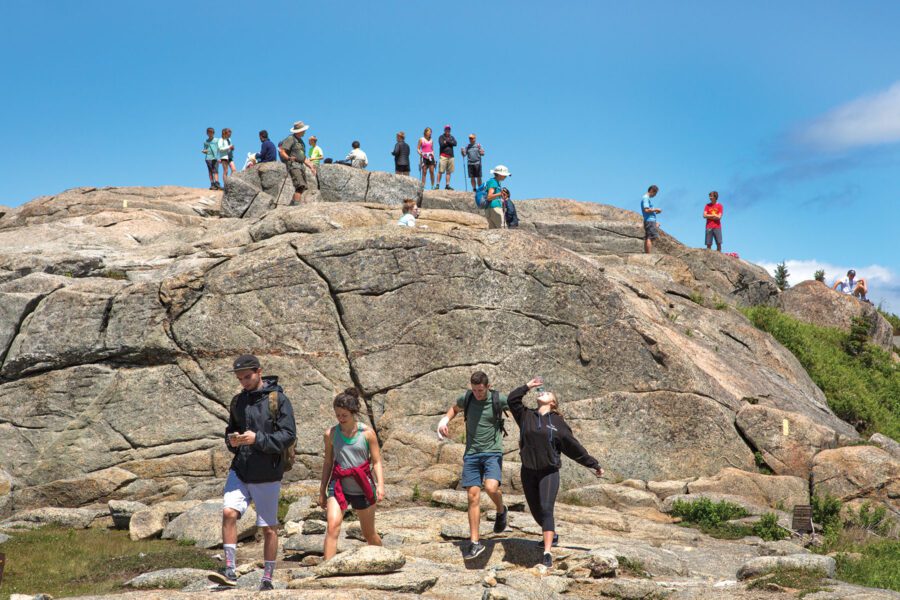 Hikers on Cascade Mountain, which is considered a "B+" hike by ADK, for its trip leader requirements