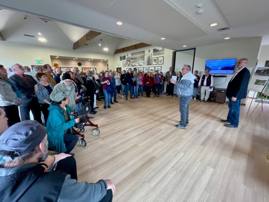 Robin DeLoria speaking at new Newcomb visitor/community center.