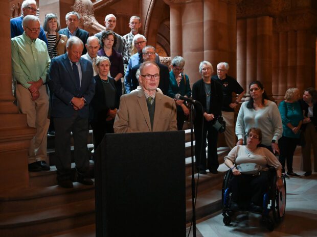Dr. John Rugge speaking at a Medicaid press conference at the New York State capitol