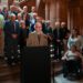 Dr. John Rugge speaking at a Medicaid press conference at the New York State capitol