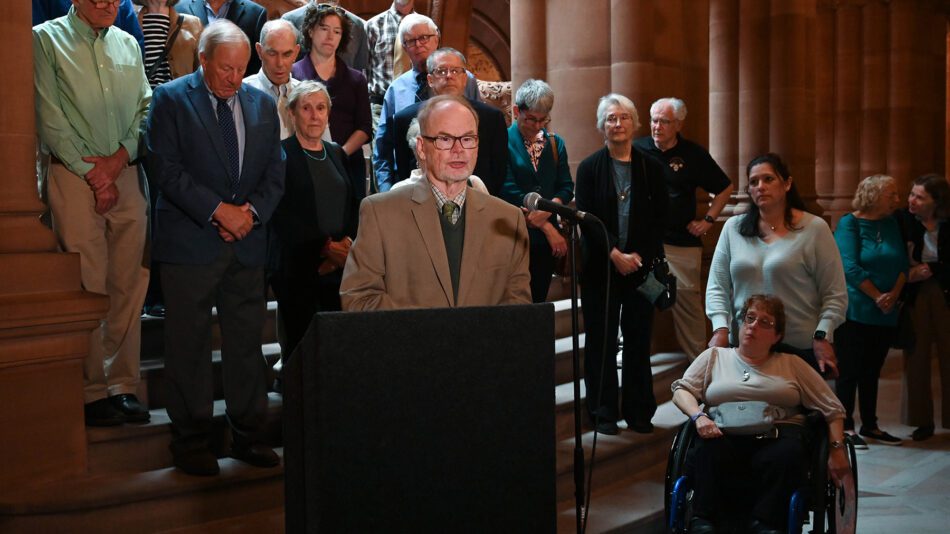 Dr. John Rugge speaking at a Medicaid press conference at the New York State capitol