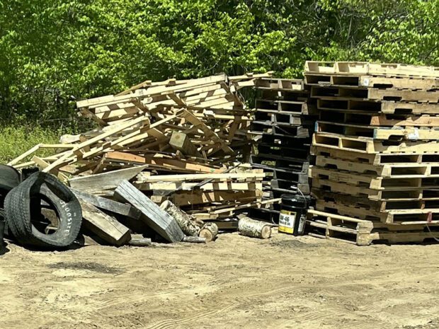 pile of pallets and tires taken by forest rangers