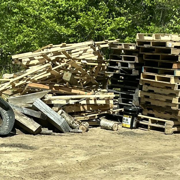 pile of pallets and tires taken by forest rangers
