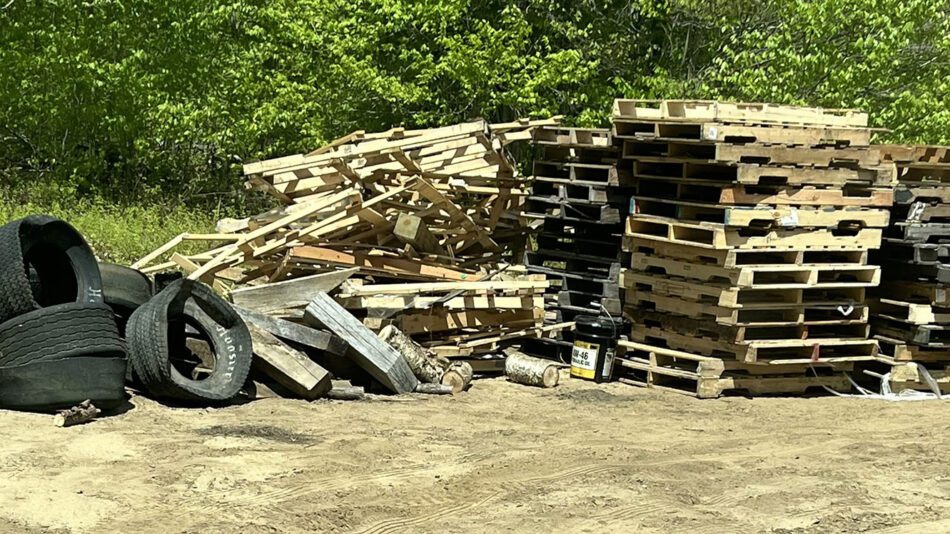 pile of pallets and tires taken by forest rangers