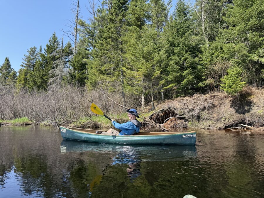 man in a canoe with a paddle
