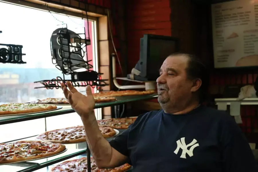 man in a pizza shop