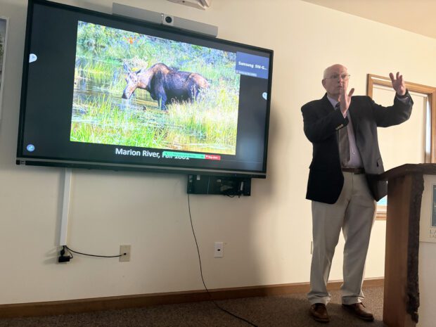 Al Hicks talks about climate change and wildlife at the Lake George Land Conservancy office in Bolton Landing. Photo by Mike Lynch